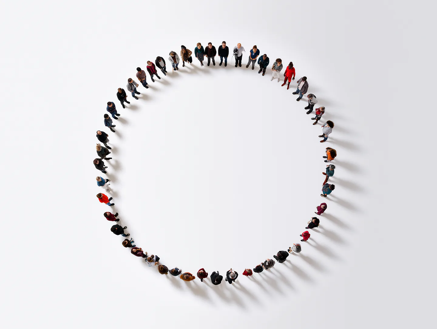 People standing in a circle around V30's marketing work